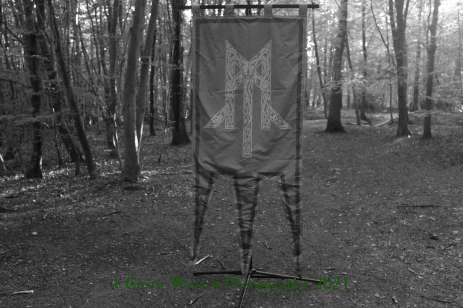 banner showing Wolcensmen logo in the woods